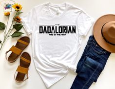 Dadalorian Shirt, Husband Gift, Daddy Shirt,  Father's Day Gift, Gift for him, Gift for Father, Valentine Gift Dad, Dad Gift, Dad Day Gifts, Personalized Dad Shirt 2024 * High quality and super soft, comfortable shirt. Made with top-of-the-line vinyl and pressed with a professional grade heat press. * Please check all color and size charts before place the order. Since all shirts are custom made based on your selection, I don't accept return or exchange unless there is an issue with your order. *We're working with different shirt brands based on the color/size availability. All shirts we use are soft style, not heavy cotton. Solid colors are all cotton and heather colors are cotton/poly blend. (there may be exceptions) *Our Sweatshirt 70% SoftLume combed and ring-spun cotton, 30% polyester Casual Fitted Tops For Father's Day, Fitted Casual Tops For Father's Day, Father's Day Shirt With Name Print And Relaxed Fit, Father's Day Shirt With Name Print In Relaxed Fit, Fitted Short Sleeve T-shirt For Father's Day, Casual Father's Day Shirt With Name Print, Dad Day Gifts, Dadalorian Shirt, Gift For Father