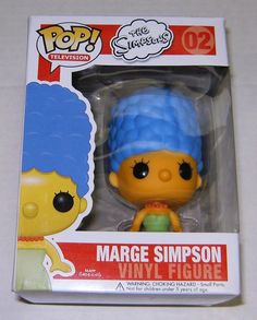 the simpsons pop vinyl figure is in its box, it's blue and has an orange hair