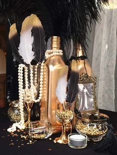 a table topped with lots of gold and white decorations