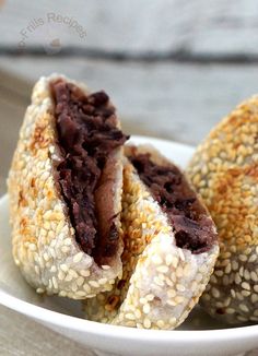 sesame seed rolls with chocolate filling in a white bowl