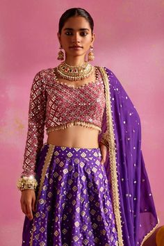 Purple banarasi lehenga with geometric woven pattern and sequins embroidered hemline. Comes with a rani pink thread and pearls embroidered blouse and a mirror work dupatta. - Aza Fashions Designer Lehenga With Motifs, Chanderi Sets With Motifs For Reception, Transitional Art Silk Lehenga With Mirror Work, Transitional Festive Lehenga With Mirror Work, Diwali Kundan Lehenga With Motifs, Designer Lehenga With Motifs In Traditional Drape, Designer Bollywood Lehenga With Motifs, Bollywood Designer Lehenga With Motifs, Festive Dola Silk Set With Motifs