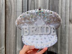 Set sail into wedded bliss with our bride to be hat. Each hat is carefully adorned with pearl BRIDE letters, white sequins and iridescent jewels. It is the ultimate accessory to add a touch of nautical charm and playful elegance to your bachelorette hens party, wedding day, or honeymoon. This distinctive hat is designed to make the bride the center of attention and let her take the helm of her love story! ✨QUALITY CRAFTSMANSHIP: Crafted with attention to detail, this hat is made to last. The dur Wedding Drinking Games, Bride Cowgirl Hat, Bridal Shower Veil, Rhinestone Veil, Bachelorette Party Bags, Party Veil, Pearl Bride, Hen Party Accessories, Pearl Veil