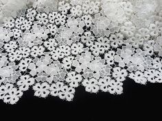 white lace with flowers on black background