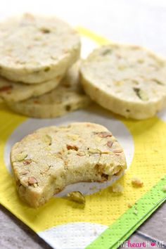 several cookies on a yellow and white plate