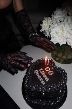 a birthday cake with the number 50 on it is being held by someone's hands