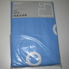 a blue sheet that is laying on top of a white tablecloth with the label kravel