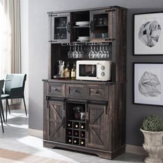 a wooden cabinet with wine glasses on it