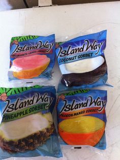 four bags of island way coconut sorbet on a white counter top, with one bag in the foreground