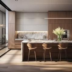 a modern kitchen with marble counter tops and wooden stools