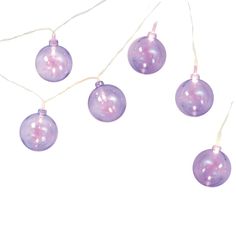 purple christmas ornaments hanging from string on white background