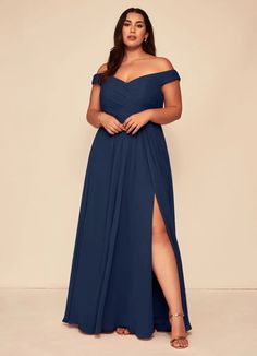 a woman in a long blue dress with thigh high slits and an off - the - shoulder top