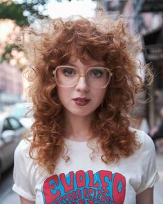 52 Chic Medium Shag Haircuts with Bangs for An On-Trend Style Choppy Bangs Curly Hair, Curly Shag Mullet Women, Curly Haircut Woman, Permed Shag Hairstyles, Curly Hair Shag With Bangs, Permed Shag, Long Curly Shag Haircut Without Bangs, Curly Shag Bangs, Medium Curly Shag With Bangs