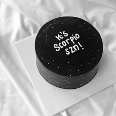 a black and white cake with the words it's scorpro 2012 on it