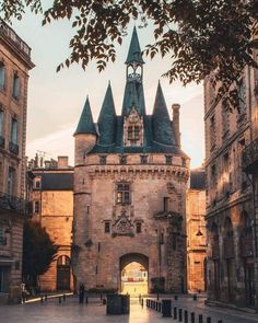 an old castle building with a clock tower