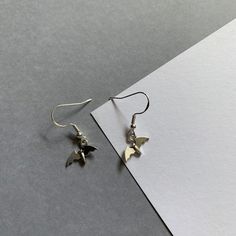 Take on a daring look with these BAT BOYS EARRINGS. These Bookish Dangle Drop Earrings in silver are perfect for any book lover. Add a touch of adventure to any outfit with these ACOTAR inspired accessories. Boys Earring, Boys Earrings, The Bat Boys, Bat Earrings, Drop Earrings Silver, Bat Boys, Cute Bat, Earring Hooks, Silver Drop Earrings