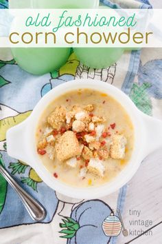 a bowl of corn chowder with croutons in it