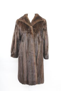 DESCRIPTION: BEAUTIFUL & VERY STYLISH DARK MAHOGANY MINK FUR COAT FOR WOMEN! THE COLLAR TYPE IS "WING", IT CLOSES WITH HOOK & EYE CLOSURE AND HAS TWO SIDE POCKETS AND BRACELET CUFFS. THIS ITEM IS PRE-OWNED: THE FUR AND THE INSIDE LINING ARE "EXCELLENT", THE BEST CONDITION POSSIBLE!  AFTER BUYING THIS ITEM, IT WOULD BE VERY MUCH APPRECIATED IF YOU COULD PROVIDE YOUR HEIGHT, WEIGHT AND BUST CIRCUMFERENCE, SO WE CAN ADJUST THE COAT TO YOUR SIZE, BEFORE SHIPPING, IF NEEDED. IT WILL ALSO HELP US TO S Formal Long Sleeve Mink Outerwear, Classic Long Sleeve Mink Outerwear, Dark Mahogany, Mink Fur Coat, Mink Fur, Coats Jackets Women, Height And Weight, Types Of Collars, Montreal