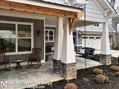 a porch with chairs and a table on it