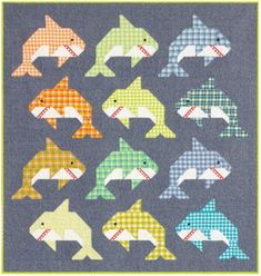 the fish quilt is made with different colors and patterns