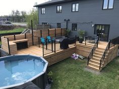 a backyard with a hot tub and deck