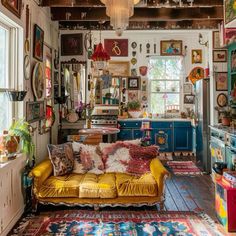 a living room filled with furniture and lots of pictures hanging on the wall above it