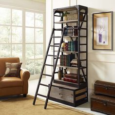 a living room with a ladder book shelf next to a chair