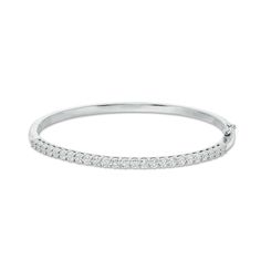 Simple and sophisticated, this diamond bangle bracelet pairs well with most any attire. Crafted in sterling silver, this refined design features a row of diamonds, each artfully set to enhance size and sparkle. Radiant with 1/4 ct. t.w. of diamonds and a brilliant buffed luster, this bracelet measures 7.0 inches in circumference and secures with a tongue and groove clasp. Classic Channel Set Diamond Bracelet, Formal Diamond White Channel Set Bracelet, Timeless Bangle With Pave Setting For Formal Occasions, Classic White Gold Cuff Bracelet With Single Cut Diamonds, Classic Diamond Cuff Bracelet For Formal Occasions, Classic White Gold Diamond Cuff Bracelet, Classic Cuff Bracelet With Diamond Accents, Classic Diamond Bracelet With Channel Set, Classic Diamond Pave Bangle Bracelet