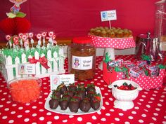 a table topped with lots of food and desserts