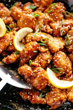 chicken with lemon and sesame seeds in a skillet