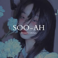 a girl with long black hair and flowers in front of her is the words soo - ah beautiful oceans