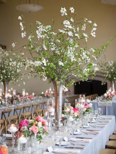 an image of a table with flowers and candles on it in front of the facebook page