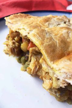 a piece of meat and vegetable pie on a plate