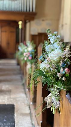 flowers are placed on the pews of a church