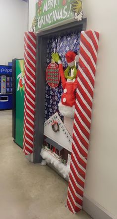 the grinch machine is decorated with red, white and green decorations