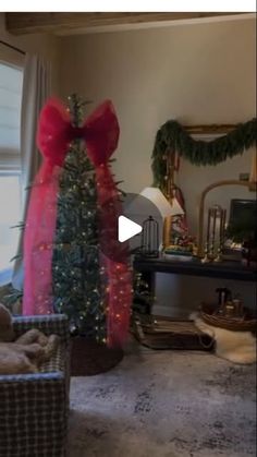 a living room with a christmas tree in the corner and presents on the table next to it