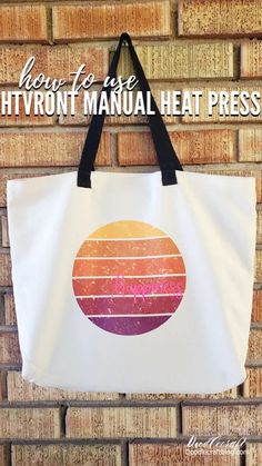 a tote bag hanging on a brick wall with the words, how to use hyront manual heat press