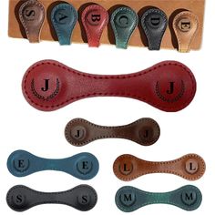 four different types of leather dog collars with the names j and j on them