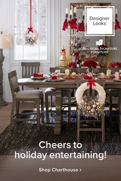 a dining room table with christmas decorations on it