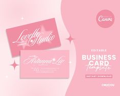 two pink business cards with white lettering on the front and back, against a light pink background