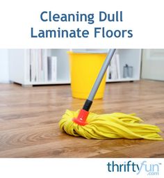 cleaning dull laminate floors with a mop on the floor in front of it