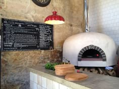 a pizza oven sitting on top of a counter