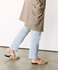 The shearling mule slide is our textural take on the classic point-toe silhouette. Soft shearling is a rich textile that stays true to our elegantly minimalist aesthetic. Time-honored craftsmanship in an unexpected finish make these the perfect accompaniment to an overall effortless look, or as a sophisticated pairing to a silk cami dress. Home Shopping List, Silk Cami Dress, Mules Outfit, Cozy At Home, Home Shopping, Animal Hide, Jenni Kayne, Silk Cami, Couture Designers