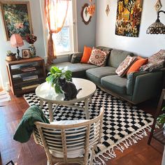 a living room filled with furniture and decor