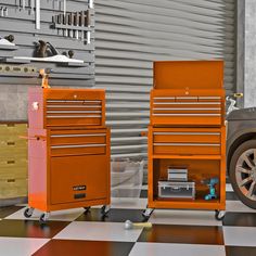 an orange tool box sitting next to a black and white checkered floor