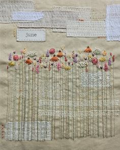 a close up of a piece of cloth with flowers and words on the side that says june