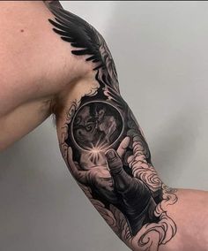 a man's arm with an angel tattoo on it