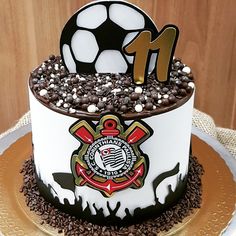 a soccer themed birthday cake with chocolate sprinkles and decorations on the top