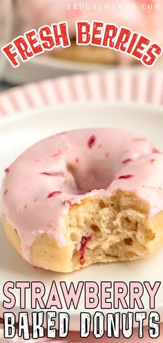 a close up of a doughnut on a plate with the words strawberry baked donuts