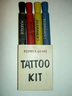 four different colored ink pens in a box with the words tattoo kit written on it