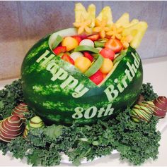 a watermelon carved to look like a fruit bowl